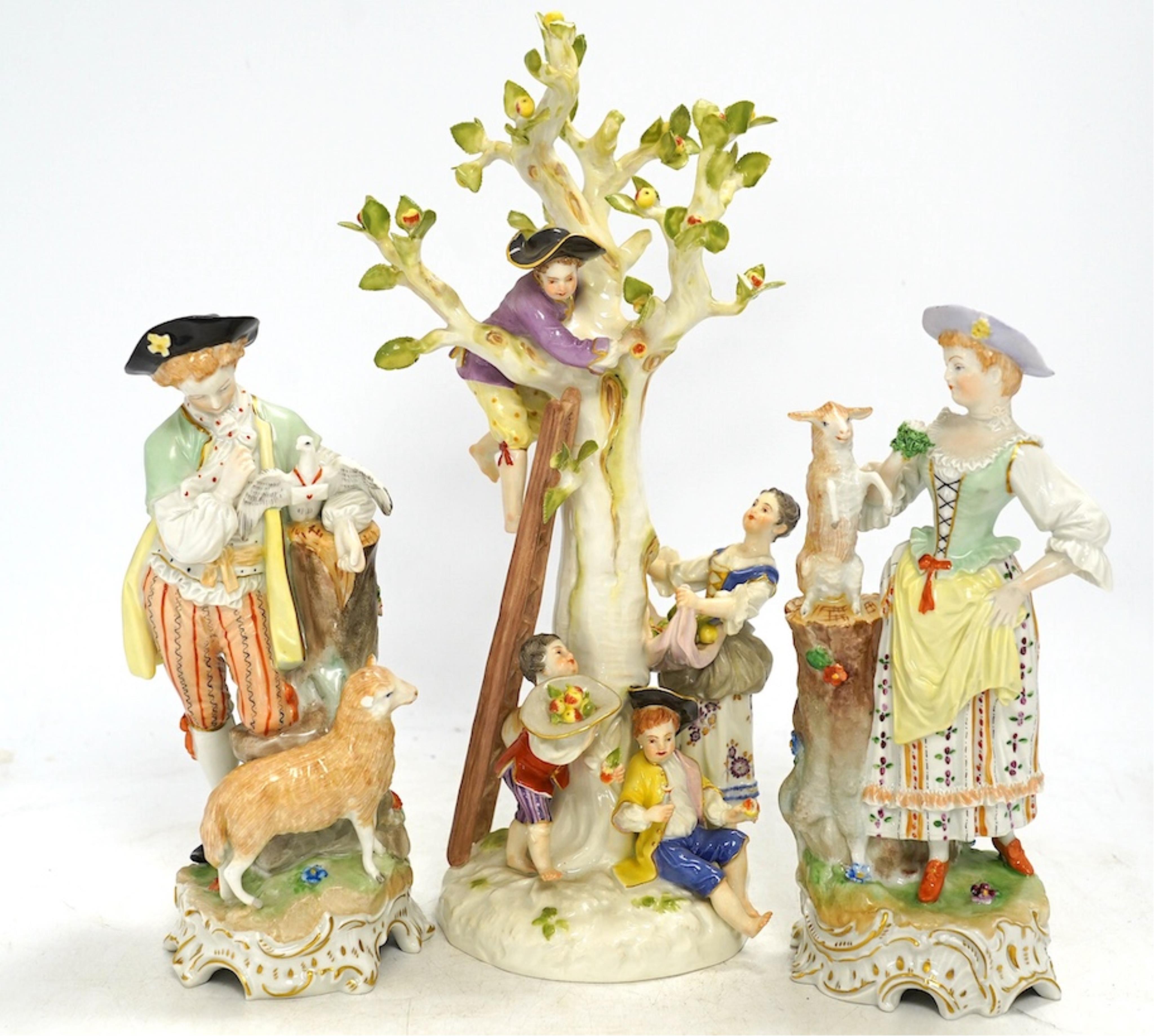 A Meissen apple pickers figure group and a pair of Dresden porcelain groups, tallest 29cm. Condition - some damage